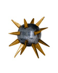 The Import Collection’s Punk Candleholder features a metallic gray sphere accented with bold gold spikes, bringing an edgy, industrial flair to your decor.