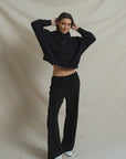 Black cropped hoodie and Georgia Crepe Pant styled with white sneakers.