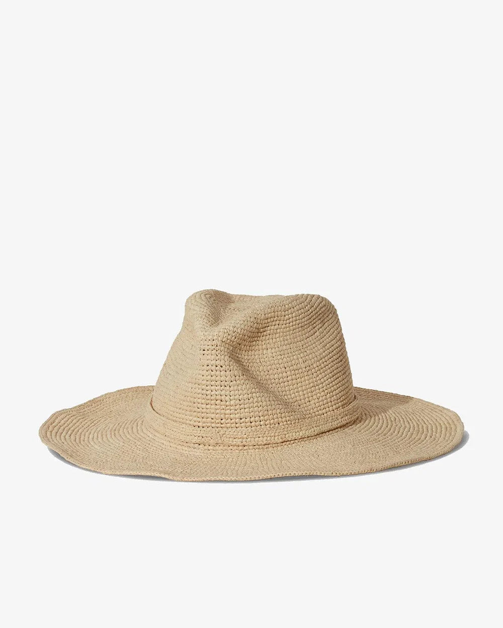 The Sacha Hat by Janessa Leone is a natural-colored, wide-brimmed western straw fedora with a rounded crown, hand-crocheted in Madagascar and shown on a plain white background.
