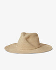 The Sacha Hat by Janessa Leone is a natural-colored, wide-brimmed western straw fedora with a rounded crown, hand-crocheted in Madagascar and shown on a plain white background.