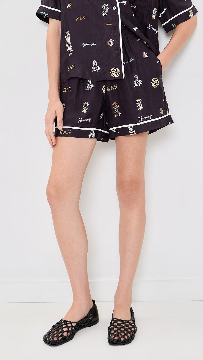 Sea New York Juliet patterned shorts in a relaxed fit, styled with black woven shoes, set against a white background.