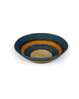 The Seagrass Small Bowl Pompadour by Faire features concentric rings of dark blue, mustard yellow, and natural beige—ideal for eco-friendly home decor.