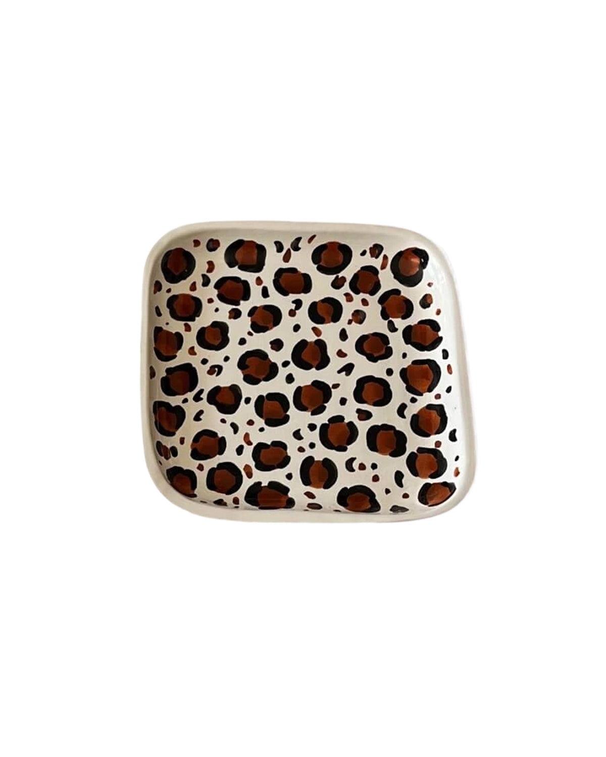 Leopard-patterned white ceramic plate with brown and black accents by Faire, hand-painted Moroccan style.