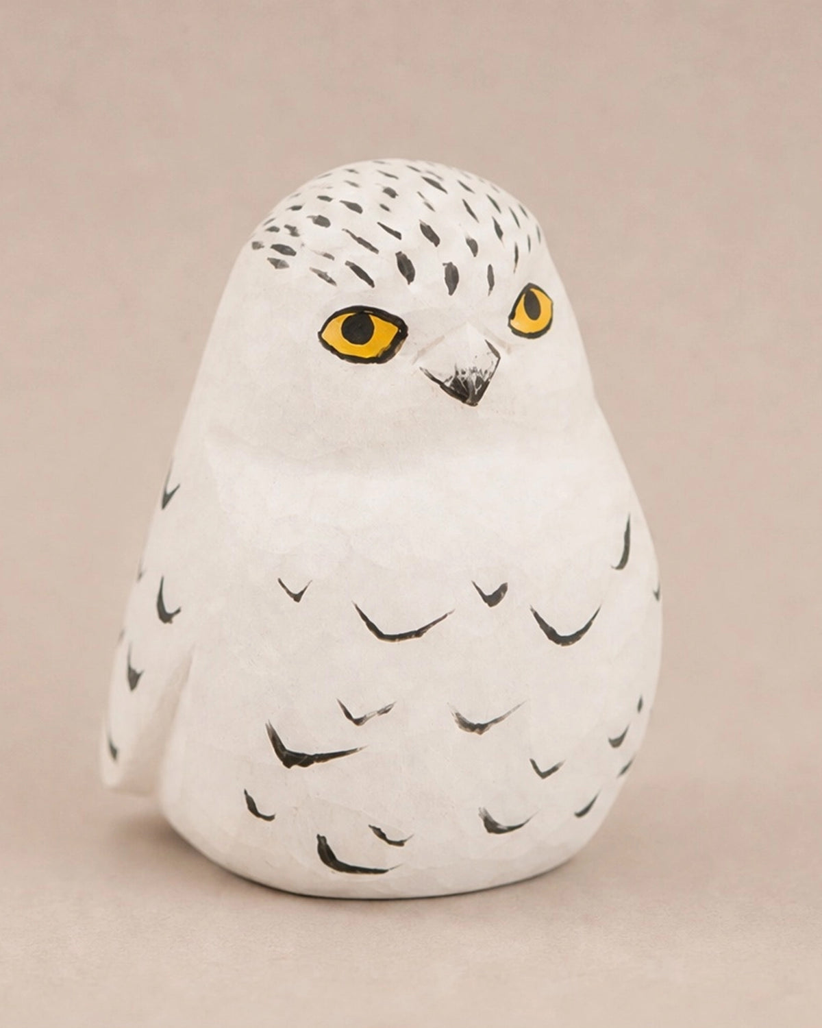 Hand-carved songbird figurine by The Faire, ideal for nature-themed décor or gifts from Bungalow Furniture & Accessories.