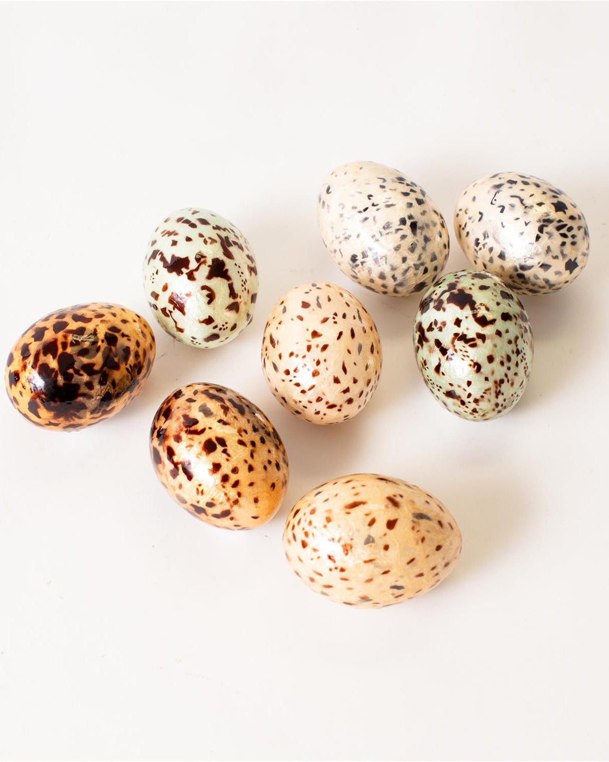 Set of 8 brown and black speckled capiz eggs by Faire, decorative accent for tabletop or spring displays.