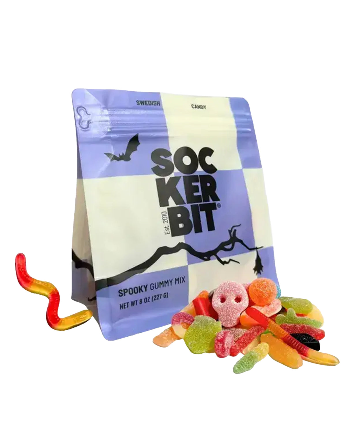 Faire Spooky Gummy Mix bag featuring skull and worm shapes with a pile of loose Halloween candy.