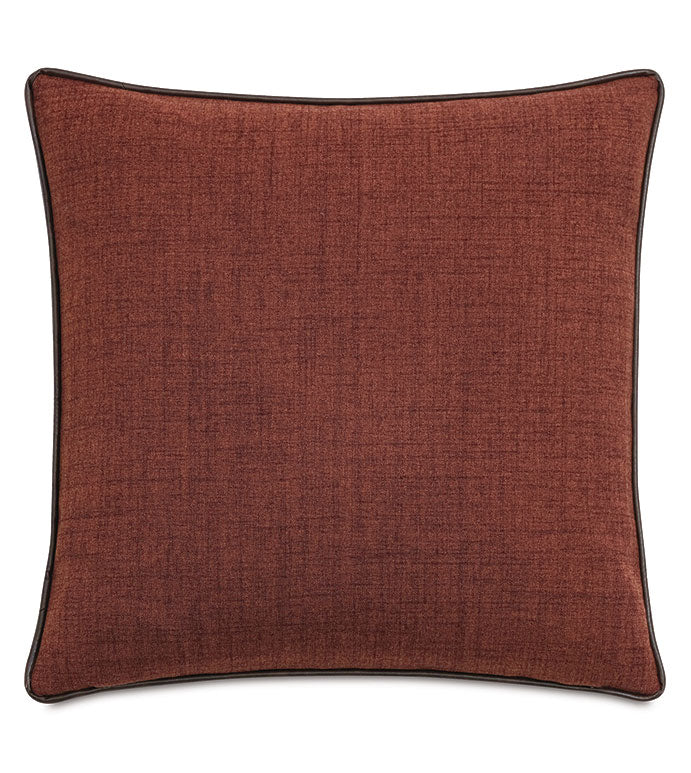 The EQUESTRIAN Pillow by Eastern Accents is a square, rust-colored decorative pillow with a subtle textured pattern and dark piping, shown against a white background.