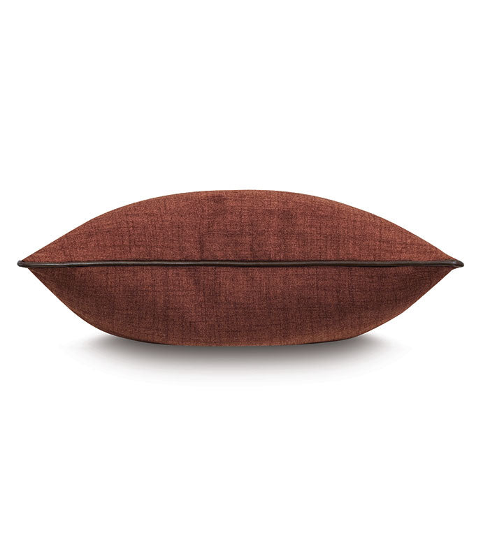 The EQUESTRAIN Pillow by Eastern Accents is a rectangular, rust-colored equestrian decorative pillow with subtly textured fabric, shown from the side on a white background.