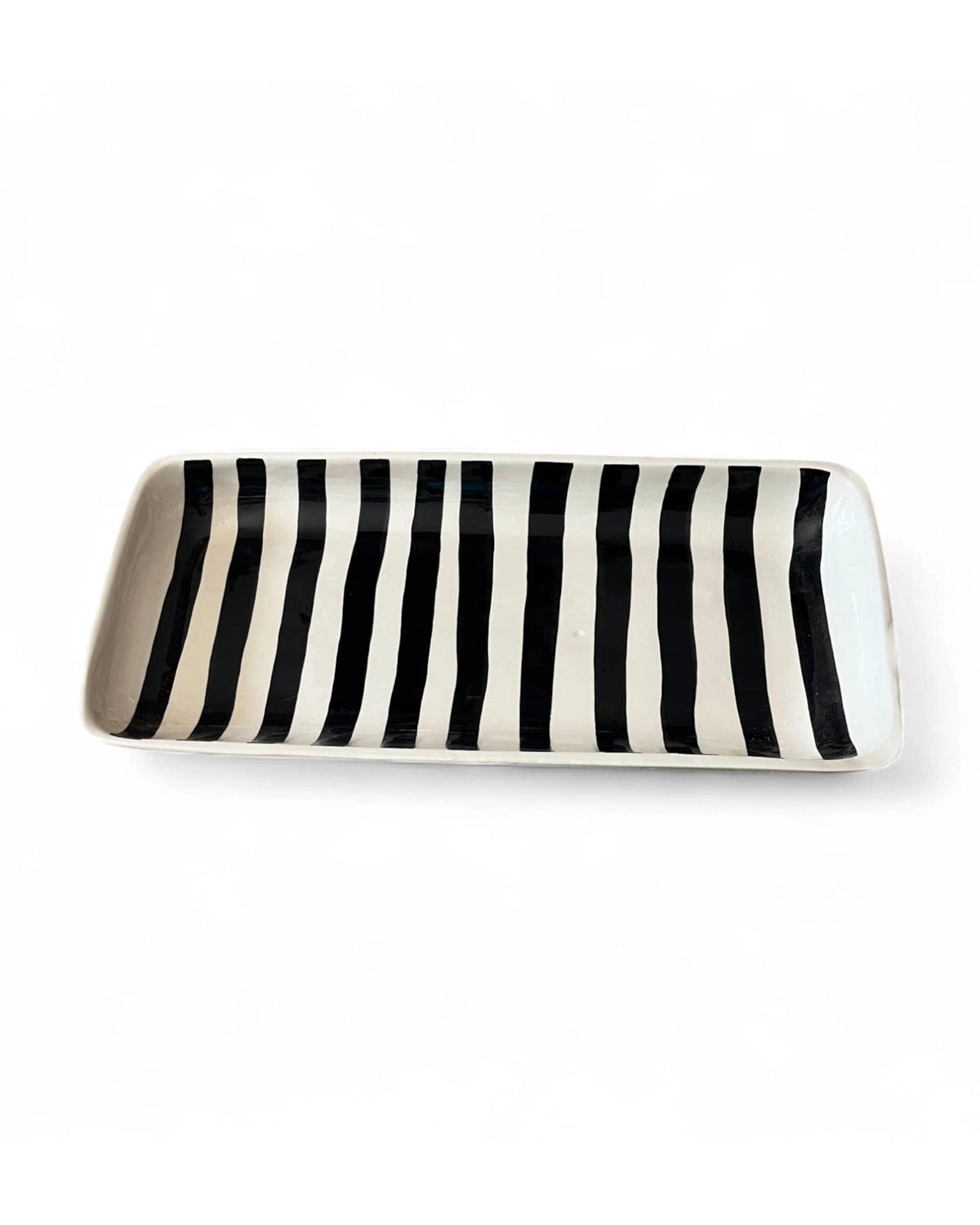 Rectangular black and white striped serving platter by Faire, handmade with Moroccan-inspired design.