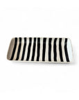 Rectangular black and white striped serving platter by Faire, handmade with Moroccan-inspired design.