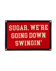 Red camp flag with cream text, inspired by Fall Out Boy, from Faire at Bungalow Furniture & Accessories.