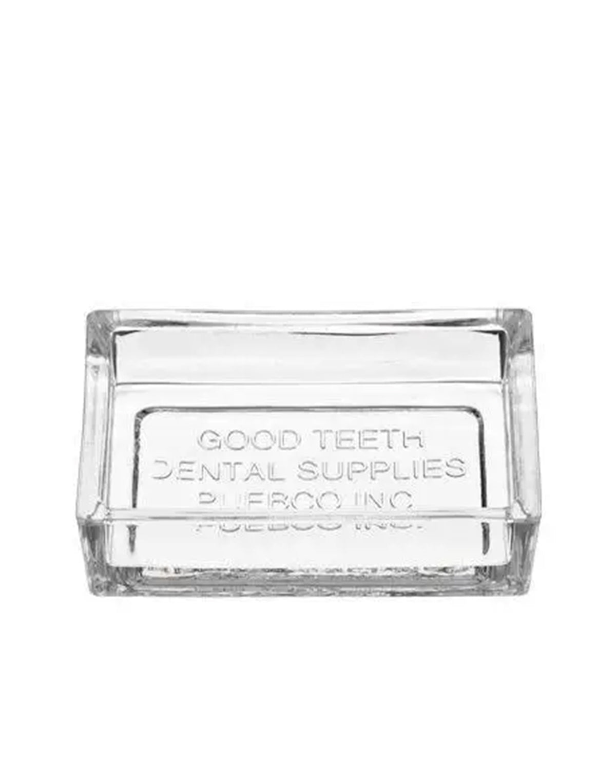 The Faire Dental Tray is a clear rectangular recycled glass piece with "GOOD TEETH DENTAL SUPPLIES PUEBCO INC." embossed on the bottom—a vintage-inspired bathroom accessory.