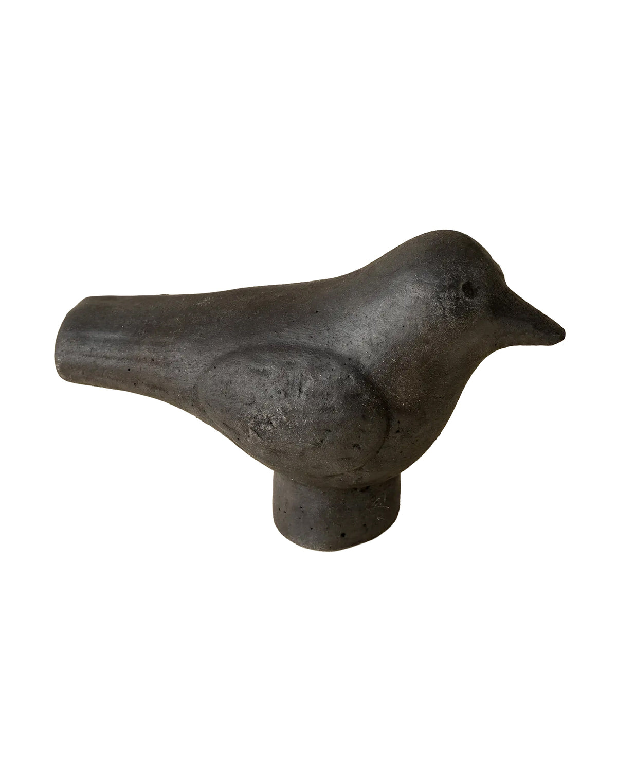 The Indaba Burnt terracotta Bird is a dark gray, minimalist statuette with a smooth finish, perched on a short cylindrical base and set against a white background.