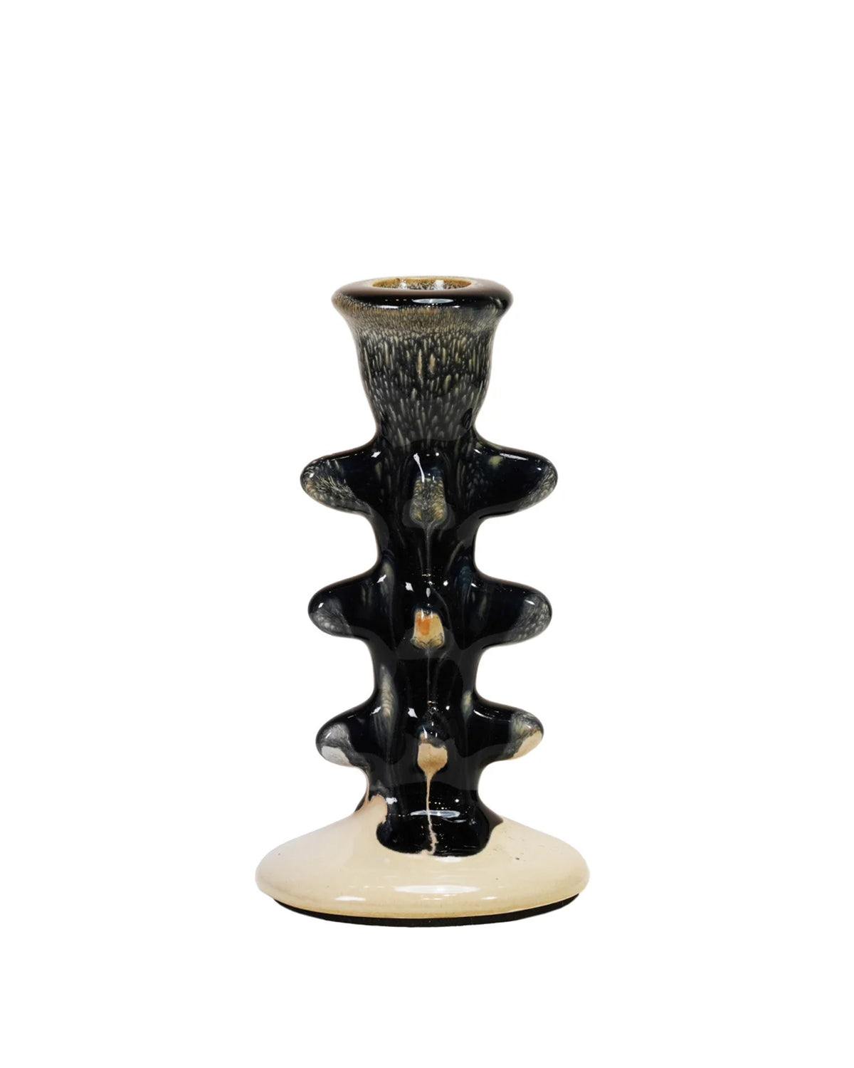 The Creative Co-op Terra-Cotta Taper Holder features a creamy white ceramic base with a glossy black, textured stem adorned with wavy ridges and a slim candle opening at the top, blending style and function.