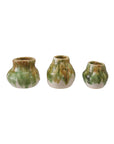 The Creative Co-op Crackle Glaze Vases are a set of three small, organically shaped vases with wide bodies and narrow necks, featuring green, brown, and cream marbled reactive crackle glaze, shown side by side on a white background.