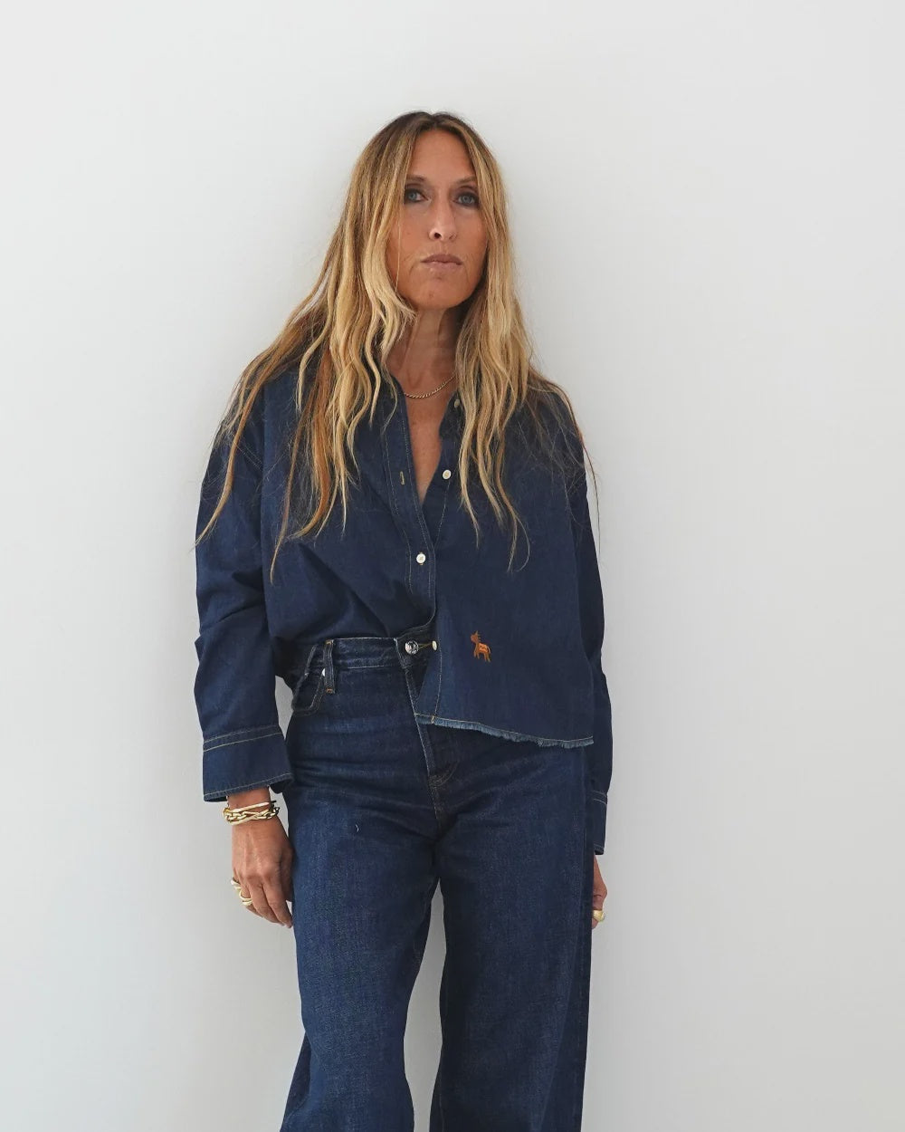 Kerri Rosenthal Tia Love Reigns shirt with heart elbow patches and matching wide-leg jeans.