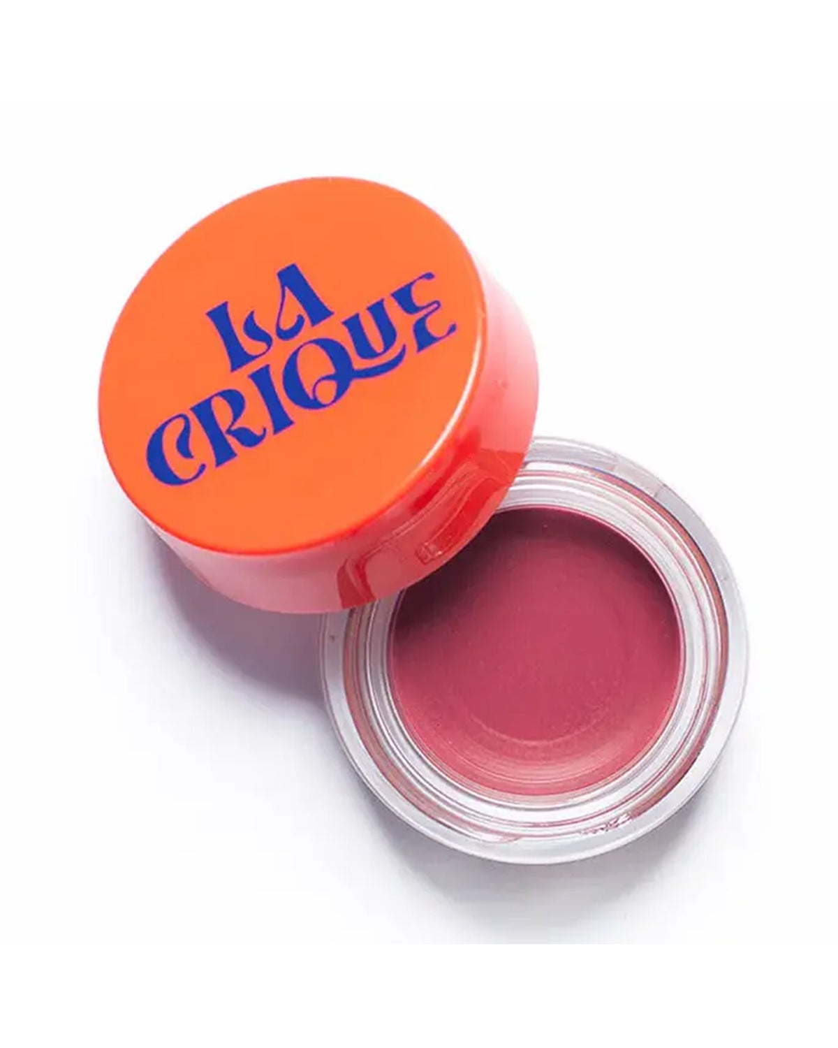 An open round container of mauve-tinted lip balm and blush from Faire, labeled "02-Tinted Lip Balm & Blush," with an orange lid, viewed from above on a white background.
