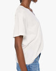 The Varsity Rowdy sweater by Mother, ivory with blue trim, styled with blue jeans, side view on white background.