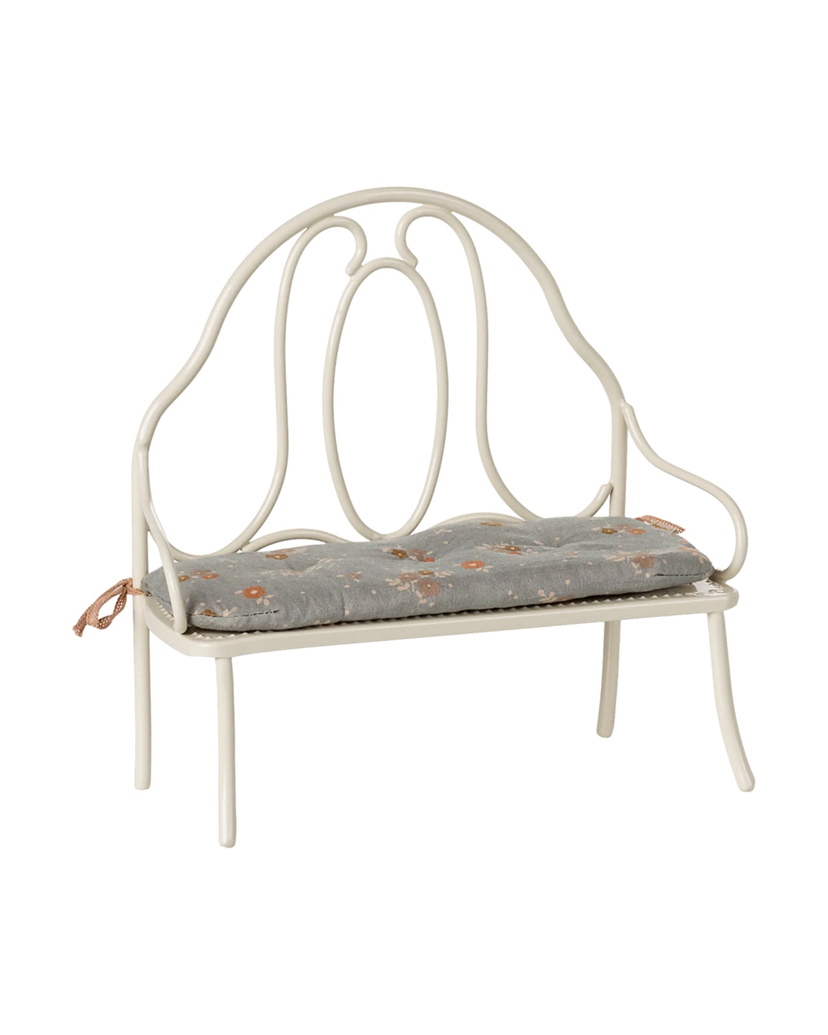 Vintage-style bench with curved backrest and floral cushion by Maileg, perfect for cozy living spaces.