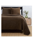 King-size brown diamond quilted cotton velvet coverlet with matching pillows by POM POM on a bed in a cozy room.