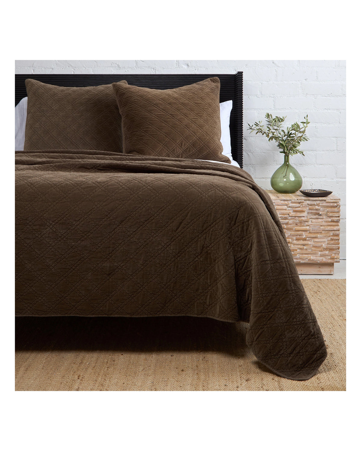 Brown POM POM Brussels Coverlet Queen with diamond pattern, matching pillows on bed in cozy bedroom setting.