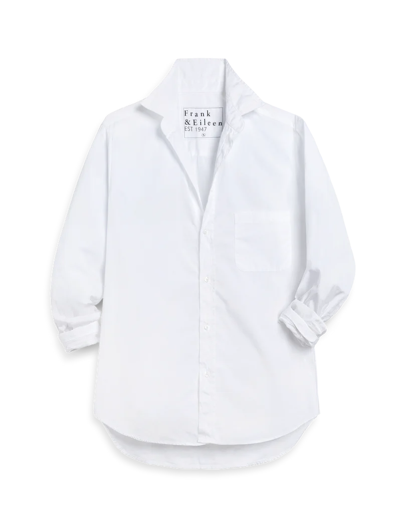 The WAVERLY Relaxed Button-Up Shirt by Frank & Eileen is a white Italian cotton shirt, featuring a collar, chest pocket, rolled sleeves, and tailored fit. The label inside reads "Frank & Eileen Est. 1947.