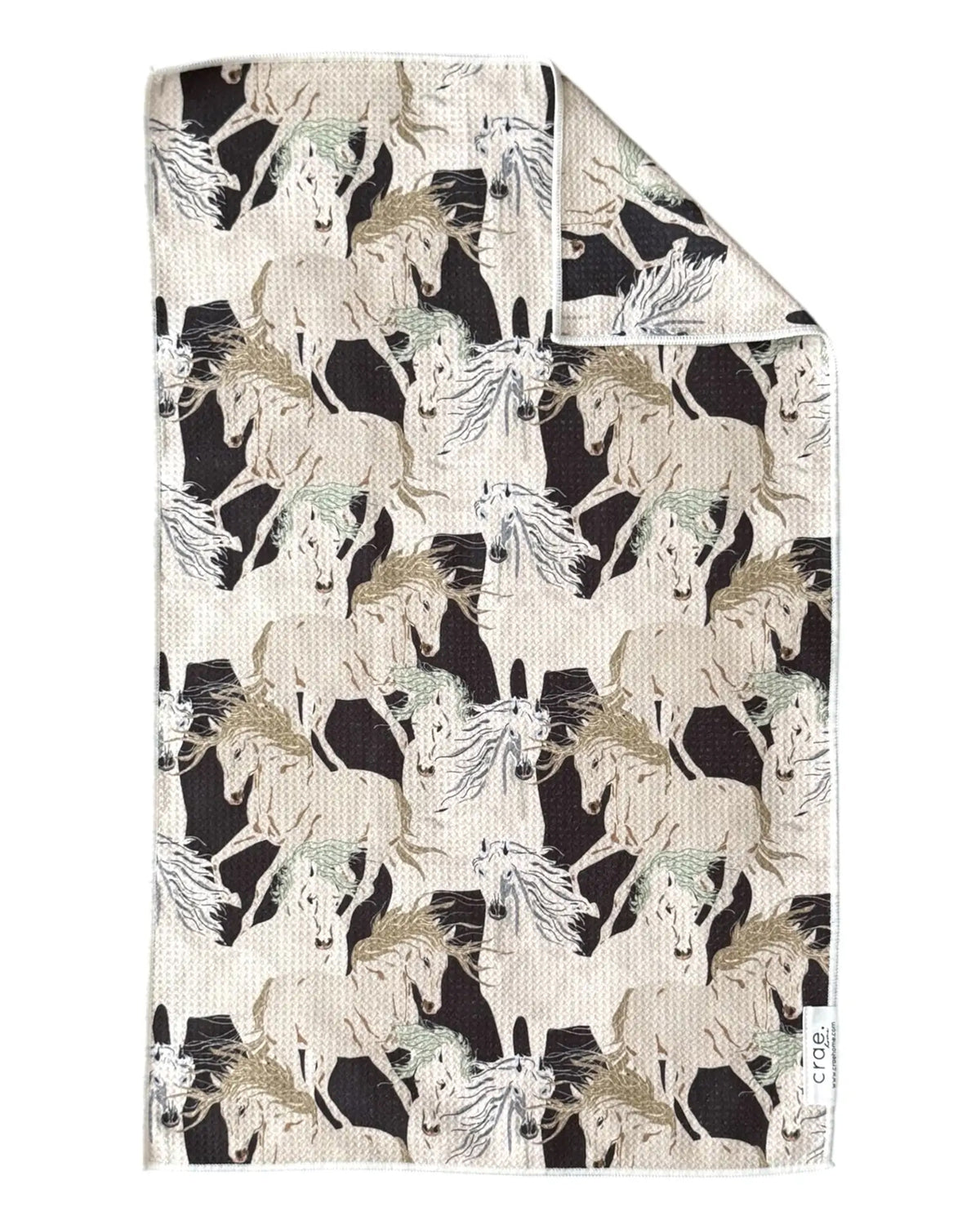 Mustang hand towel from Bungalow Furniture &amp; Accessories in a cream and black waffle-weave running horse pattern.