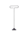 The Desk Wire Display Stand L by Faire features a minimalist design with a flat hexagonal base and a single steel rod that bends into a horizontal loop, creating a T-shape, all crafted from reclaimed steel. Shown against a plain white background.