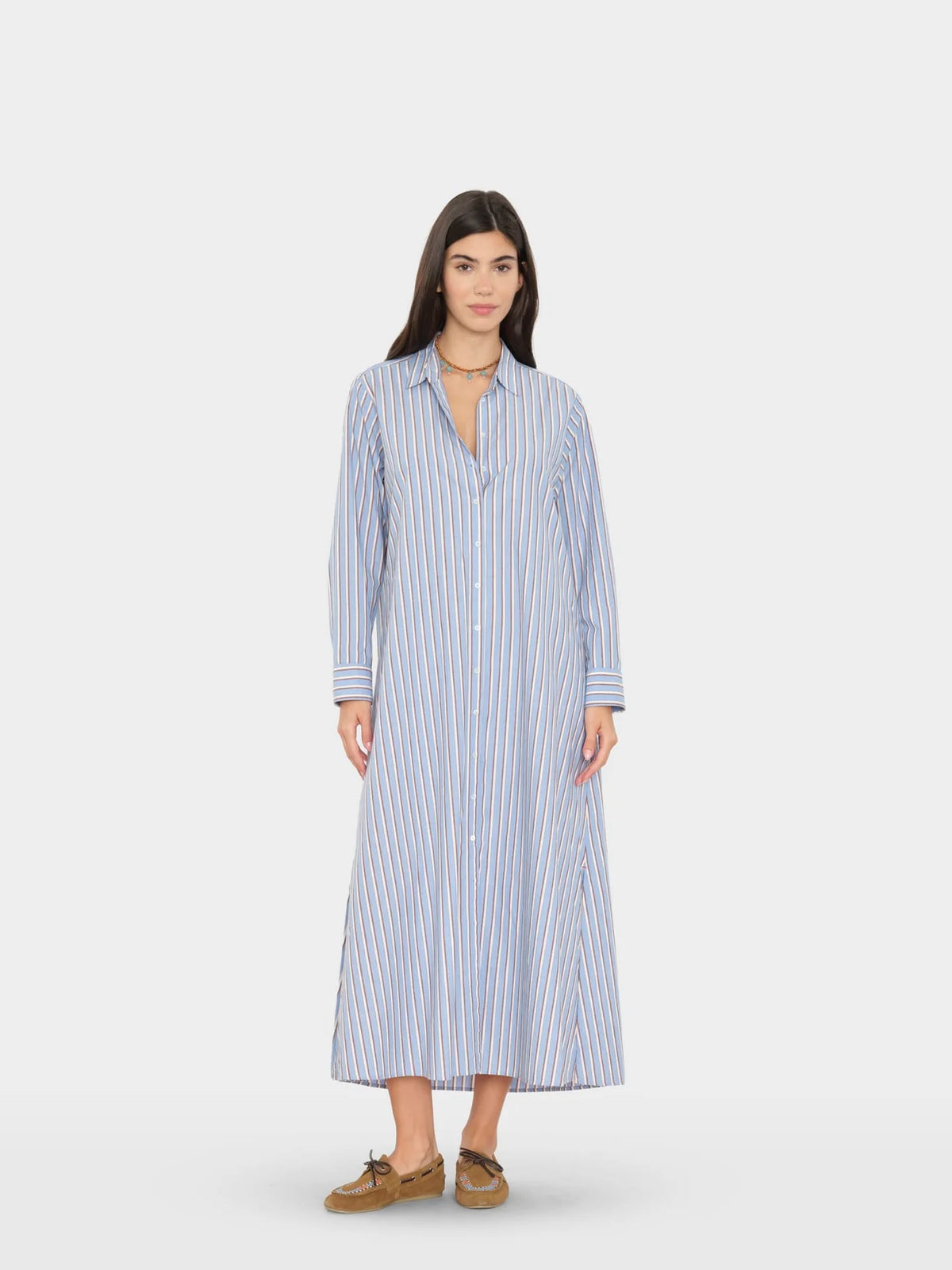 Blue and white striped Xirena Boden dress with long sleeves, styled with brown shoes for a chic, relaxed look.