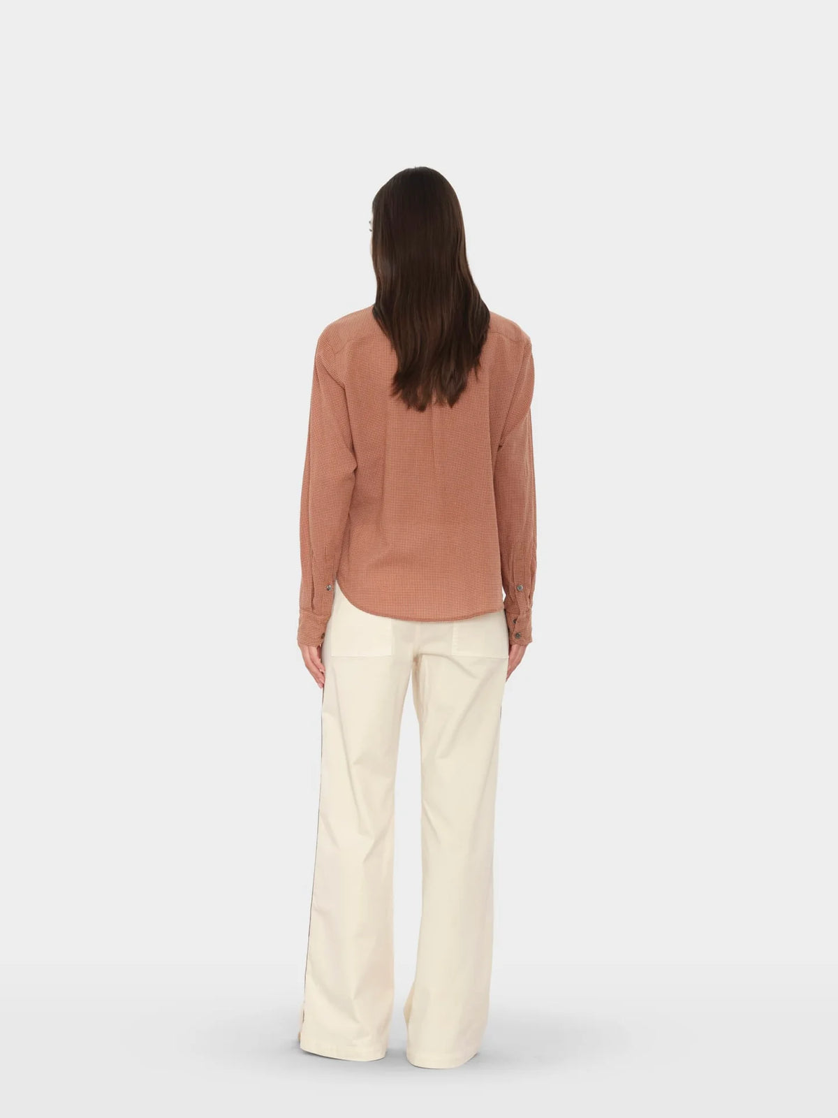 Xirena Bradshaw Pant with brown long-sleeve shirt, modern minimal style, neutral backdrop.