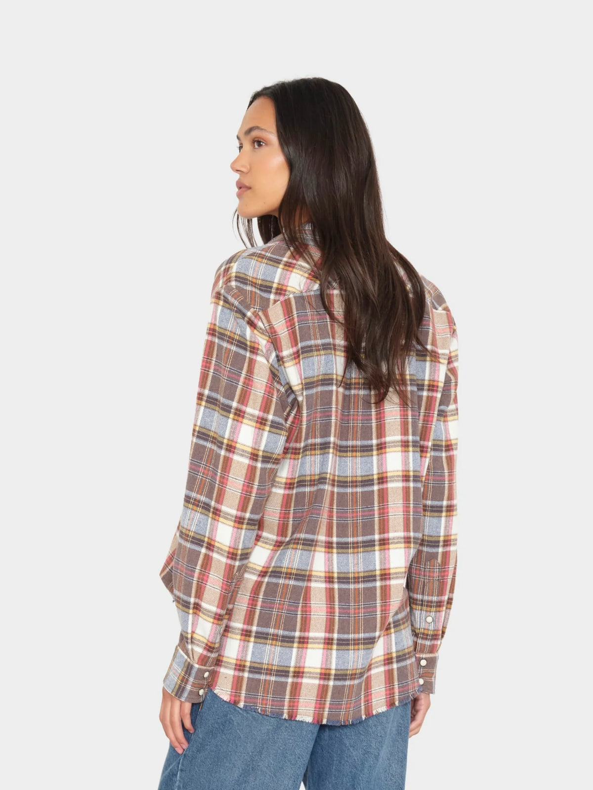 Xirena Beau Shirt in red, blue, and yellow plaid shown from the back on a model with long dark hair.