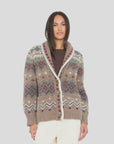 Xirena Vail Sweater in brown with colorful patterns, styled with cream pants against a neutral background.